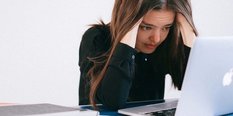 5-Canva-Stressed-Woman-Looking-at-a-Laptop