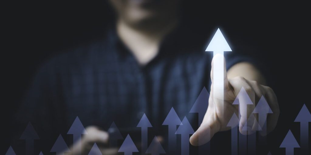 24-businessman-touching-glowing-increasing-arrow-business-profit-investment-growth-concept